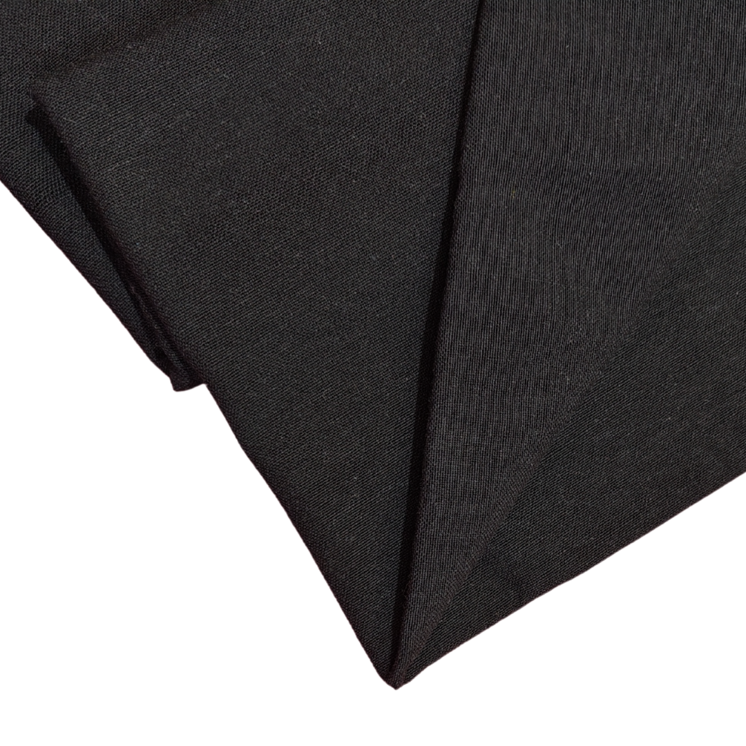 casement embroidery fabric in black shade, as viewed from top, placed on white background