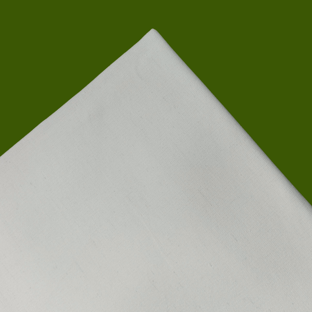 White Embroidery Fabric placed on Green Background