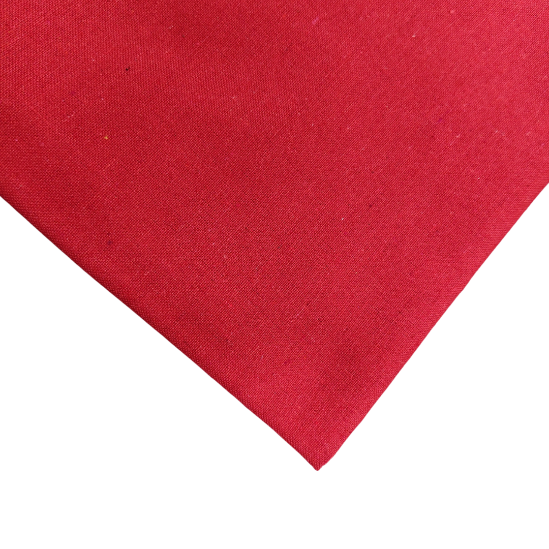 casement embroidery fabric made of red color cotton weaves, placed on white background