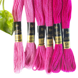 Different shades of pink embroidery thread set with codes 55, 57 and 5436 by Anchor