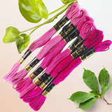 Vibrant bunch of Anchor Embroidery Thread Set in different shades of pink  with color codes 5436, 055, 057