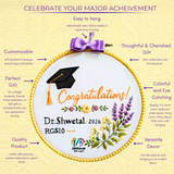 A promotional infographic for a personalized embroidery hoop art piece. The central product shows a white fabric embroidery hoop with a yellow beaded border, a purple satin ribbon bow, and a black graduation cap.